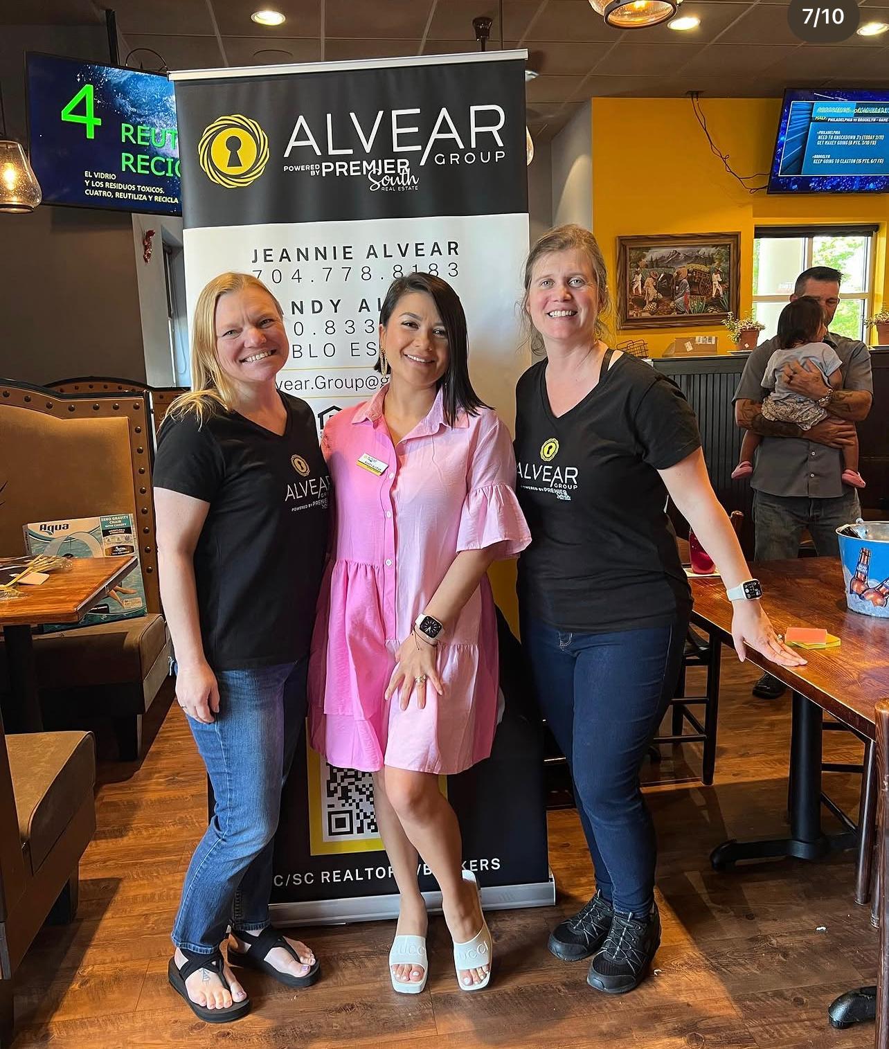 Sandy Alvear and clients at Alvear Group community event